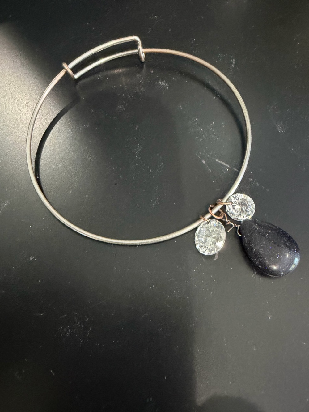 Silver-Tone Bangle Bracelet with Black Teardrop and Crystal Charms